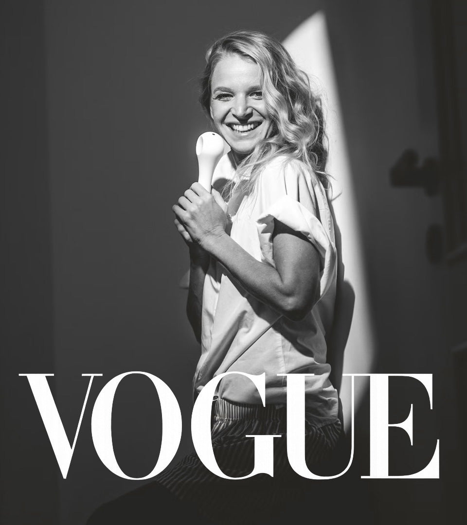 Black and white editorial portrait of designer Anna Maresova holding the white Whoop-de-doo vibrator for Vogue magazine.