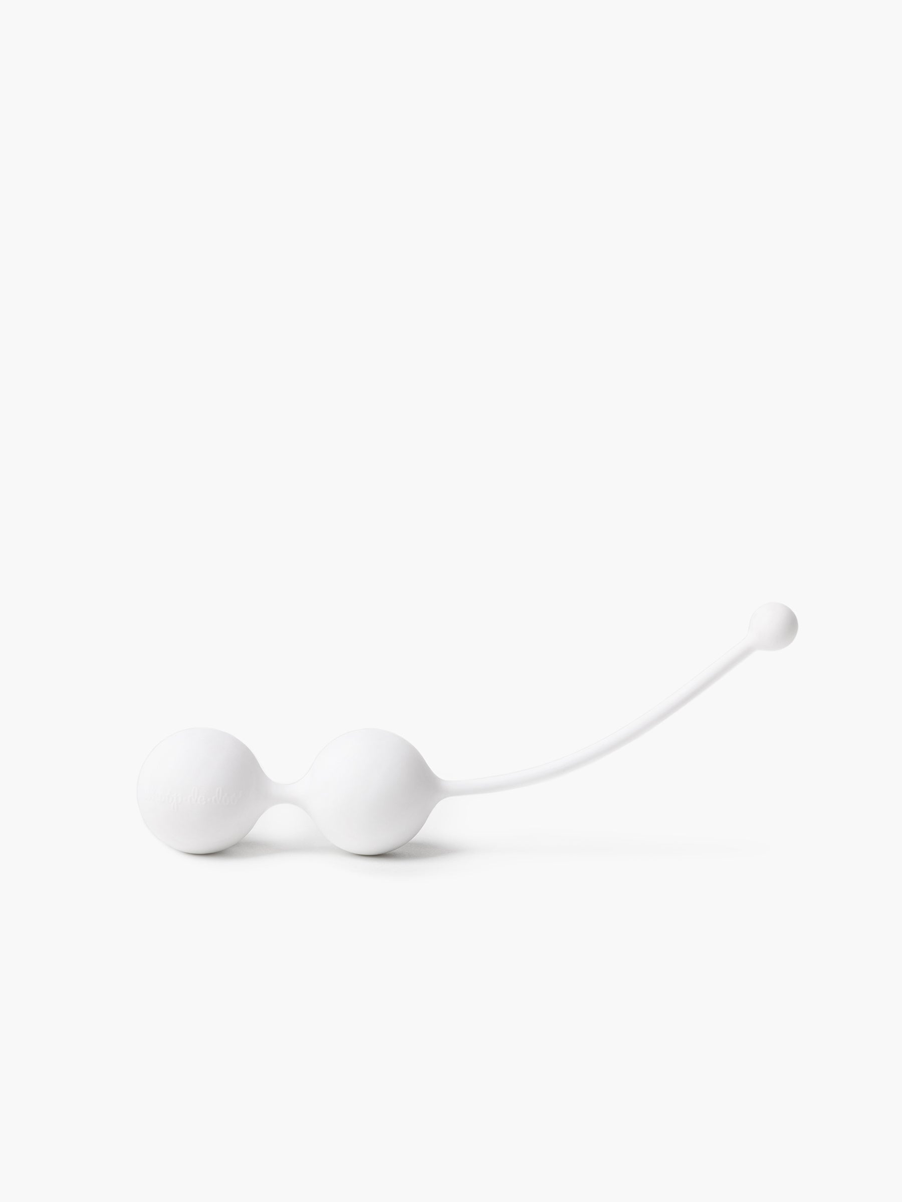 Clean product view of white Whoop-de-doo Kegel balls made of medical-grade silicone on a white background.