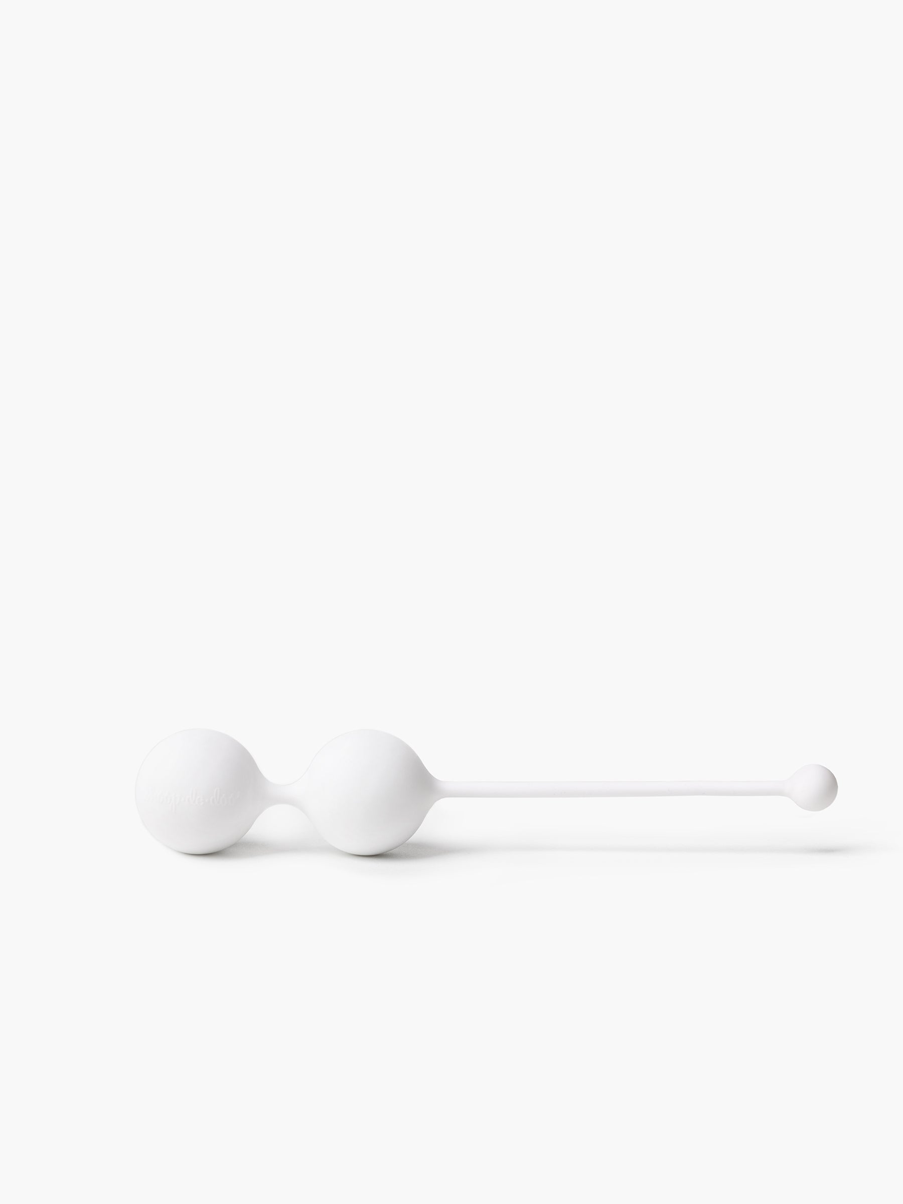 Product close-up of white Whoop-de-doo Kegel balls made of medical-grade silicone without packaging on a white background.