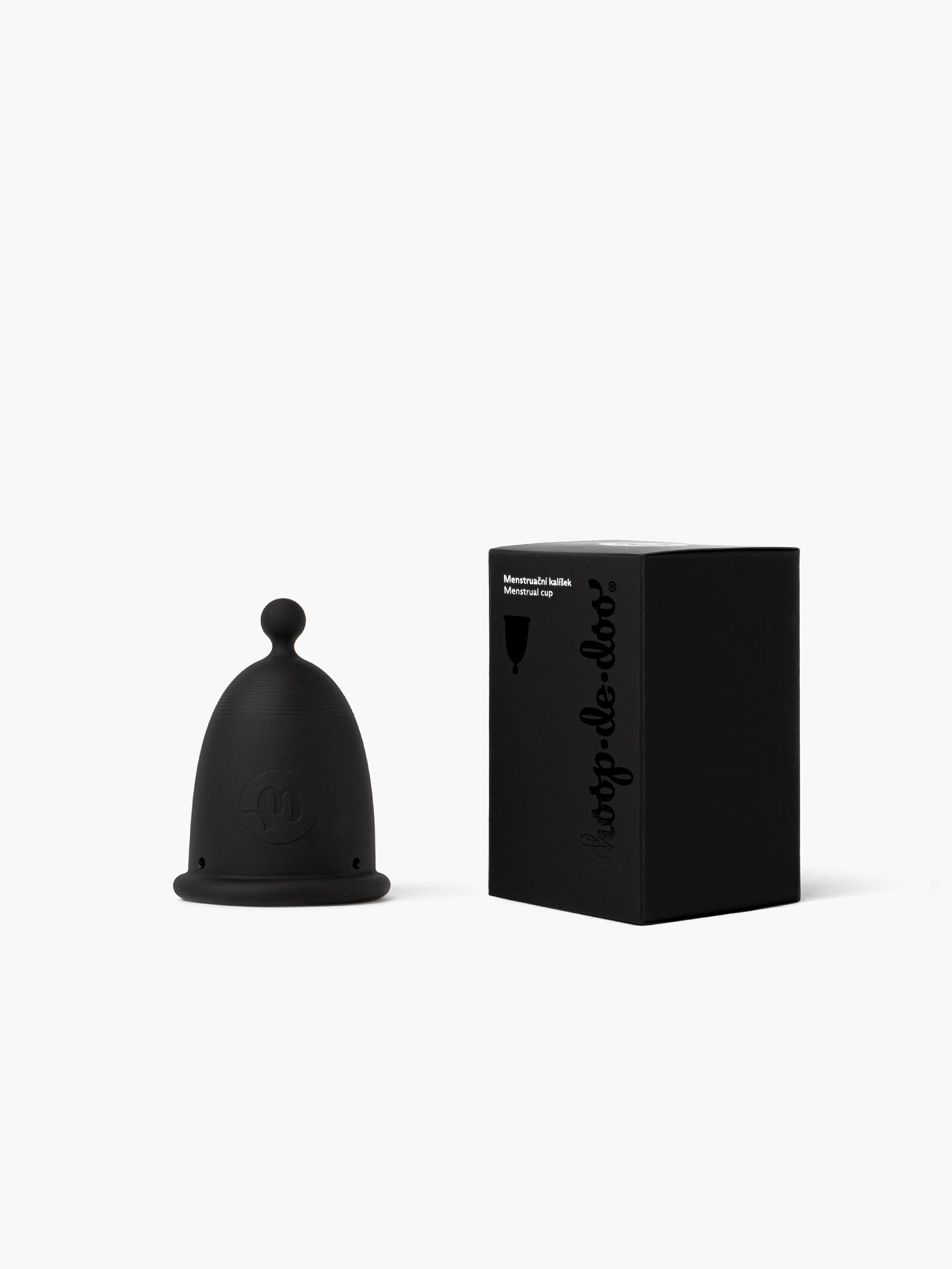 Black-grey Whoop-de-doo Menstrual Cup Classic displayed next to its elegant minimalist black packaging box on a white background.