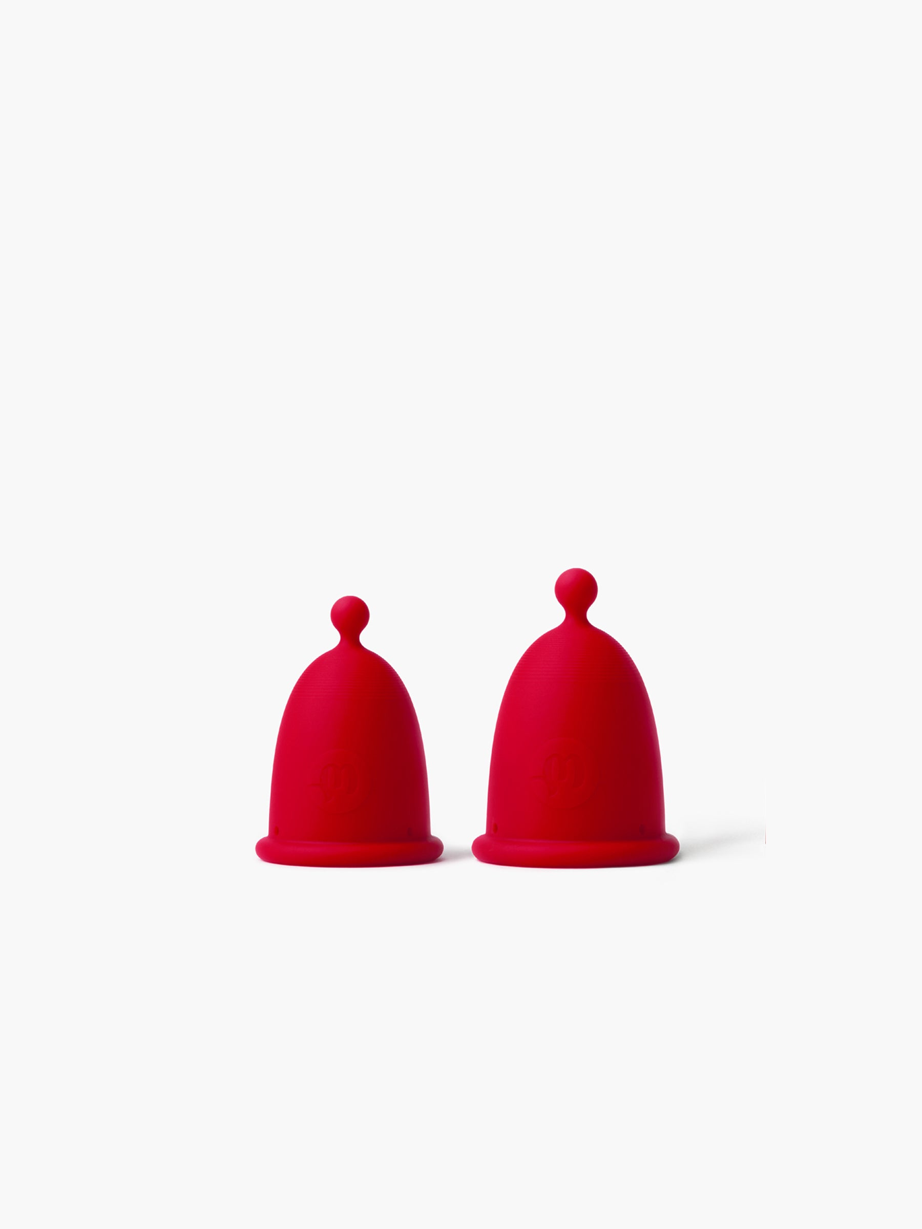 Practical Duo pack of Whoop-de-doo menstrual cups in red and black-grey, including both sizes for flexible protection during heavy and light flow days.