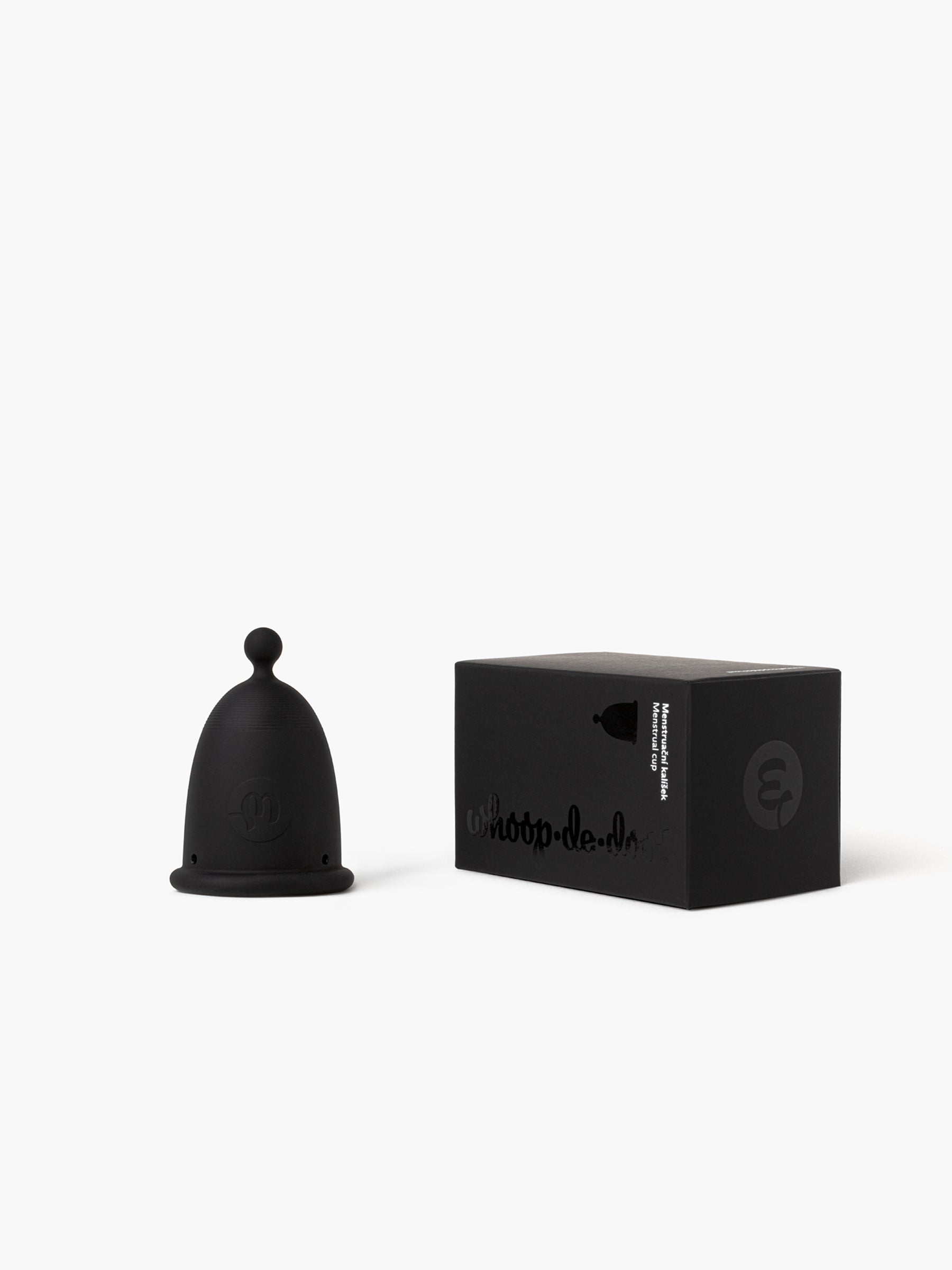 Whoop-de-doo Menstrual Cup Light version in elegant Noir grey shade displayed next to its stylish black eco-friendly packaging box.