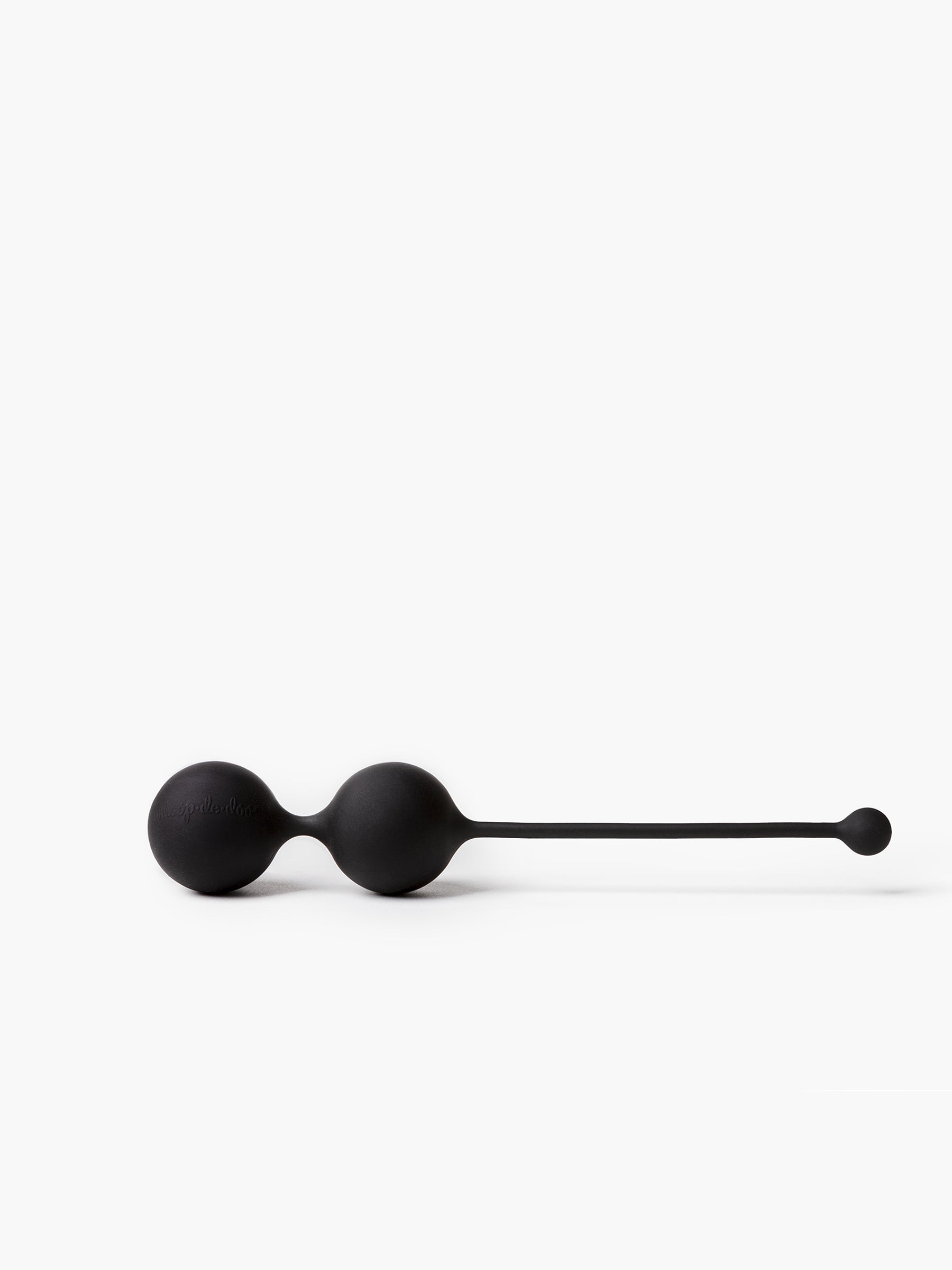 Minimalist black Whoop-de-doo Noir Kegel balls made from premium hypoallergenic silicone displayed on a clean white background.