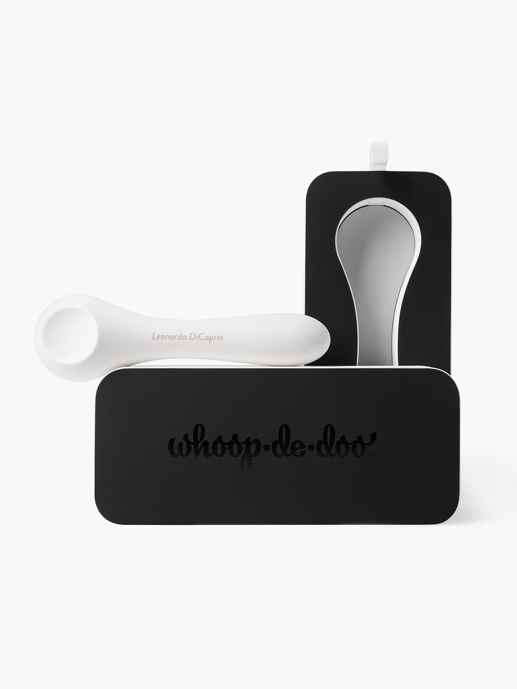 White Whoop-de-doo vibrator with custom engraved name on a premium black gift box, showcasing personalized product service.
