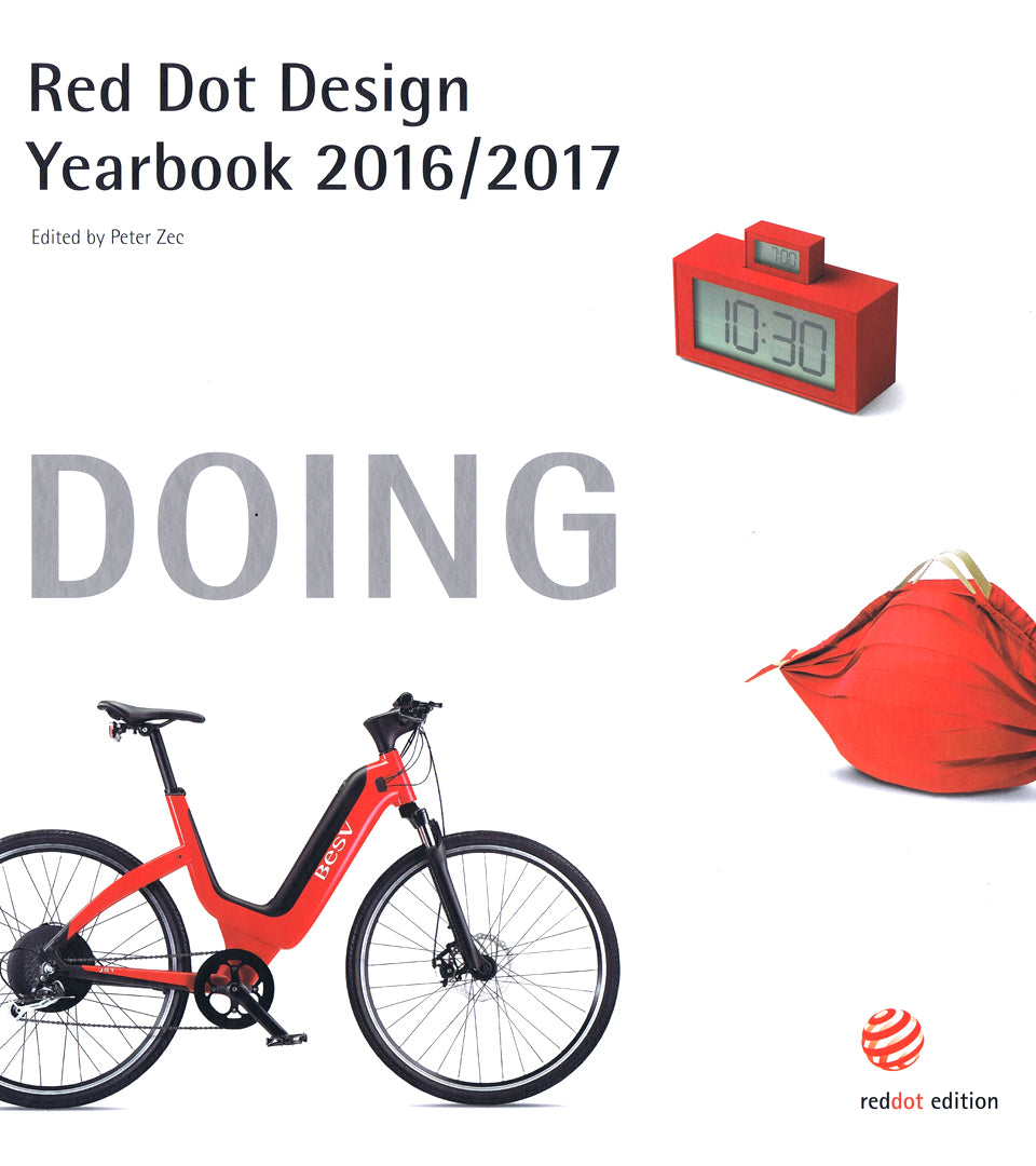 White cover of the international Red Dot Design Yearbook titled Doing, showcasing global recognition for Whoop-de-doo's premium design.