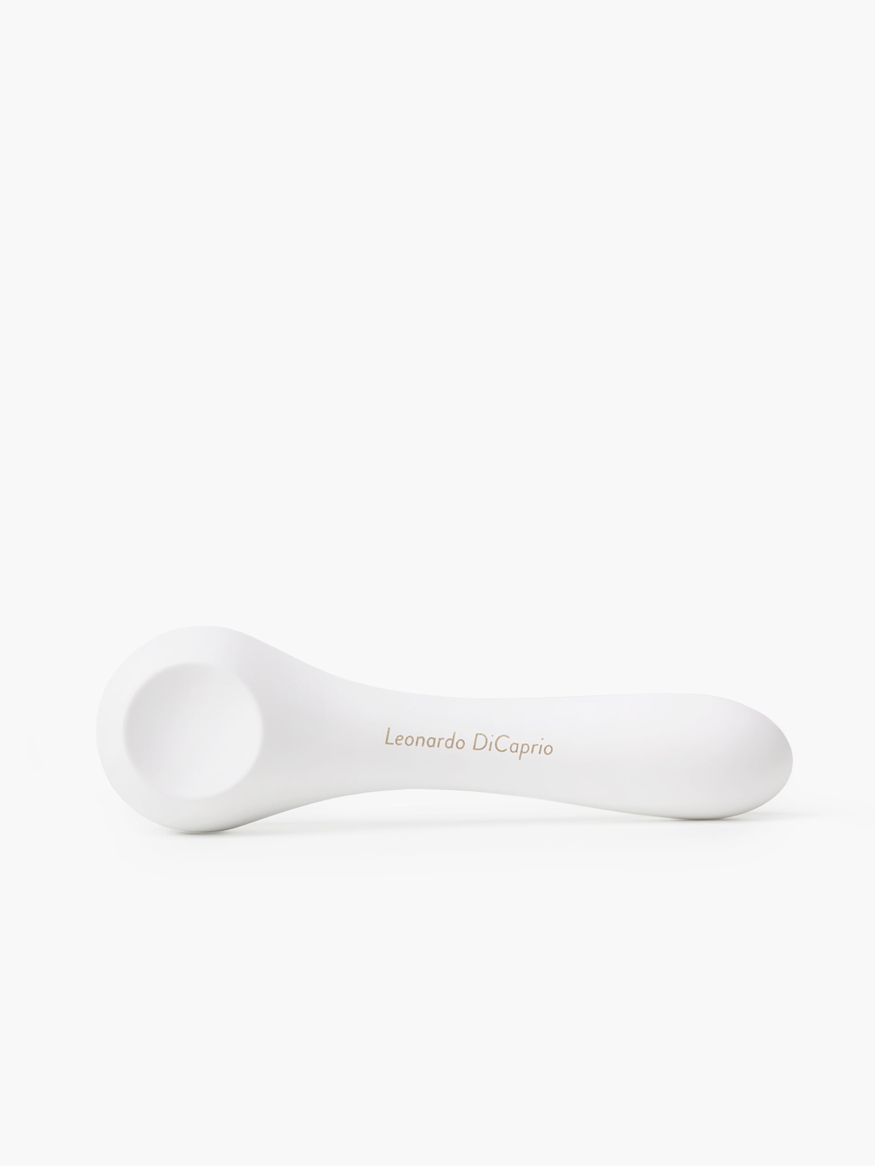 Close-up of a white Whoop-de-doo vibrator showcasing custom laser name engraving for a personalized intimacy product.